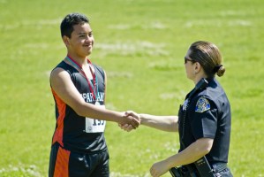 special_olympics4 Ivan Rodriguez, a Special Olympics athlete, stands proud while he receives his award from a San Jose police officer. Photo by Olivia Irvin.