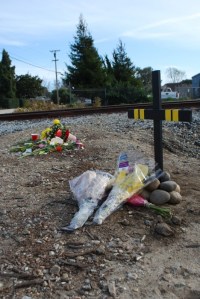 Flowers, pictures and a cross mark the spot where Quaye died on February 7. Photo by Rosario Serna.