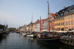 ::The Nyhavn district of Copenhagen is a popular spot for tourists and residents alike. The street is closed to vehicles, so pedestrians and bicycles mingle alongside cafés on the waterfront. Photo by Andrew Allio.